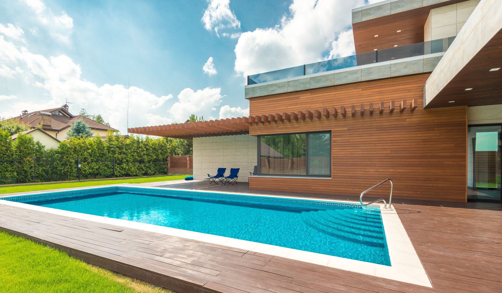 Sunny vacation home with a turquoise backyard pool